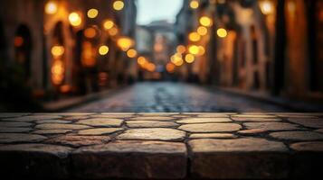 Atmospheric cobblestone perspective with blurred street lights beckoning in the night photo