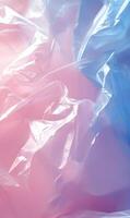 Translucent layers of plastic create a dreamy pastel abstract with delicate folds and light photo