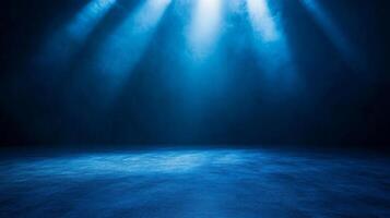 Dramatic spotlights shine down, illuminating a cool blue stage with textured surface photo