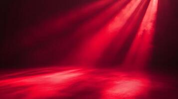 Crimson radiance illuminates empty space, a theatrical stage bathed in ruby light and shadow photo