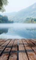 Wooden Dock Pier Over Serene Lake with Misty Mountains in the distance for a peaceful day photo