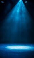 Mysterious luminous blue spotlights beaming down on a dark enigmatic stage background photo
