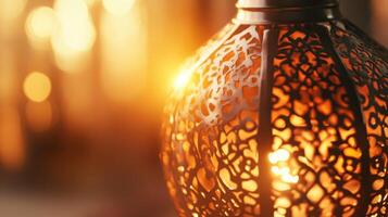 Ornamental lantern with intricate metalwork casting warm light and shadow interplay photo
