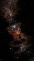 A vibrant cosmic nebula showcasing swirling gases and stardust in deep space video