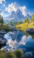 Majestic peaks mirrored in serene alpine lake under ethereal clouds and azure sky photo