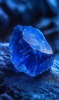 Captivating Sapphire , An intricate close up shot of a vibrant blue gem on a textured surface photo