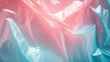Iridescent Plastic Sheet Reflecting Light with Gradient Hues of Coral and Cyan creates artistic vibe photo