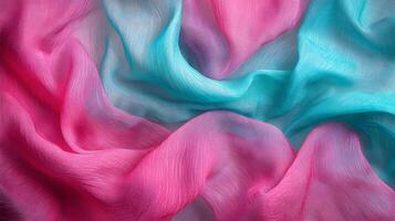 Delicate interplay of magenta and cyan hues in soft rippling silk fabric backdrop photo