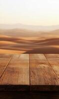 Wooden tabletop surface with a blurred desert landscape background and warm lighting hue photo