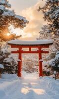 Serenity Through Snow Covered Torii Gate, A Winter Pathway at Dawn with Golden Sunlight photo