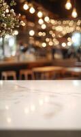 Elegant marble table top at cozy cafe, soft lighting creating warm, inviting ambience interior photo