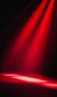 Dramatic illumination design with converging crimson beams on dark backdrop creates a strong focus photo