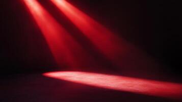 Crimson illumination highlighting a textured surface against a stark pitch black background photo