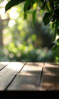 Wooden table and verdant foliage backdrop create a tranquil and natural atmosphere photo