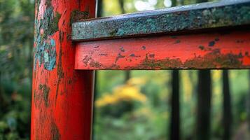 Weathered vermilion gate, showcasing a juxtaposition of strength and natural decay outdoor photo