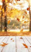 Autumn's embrace, golden leaves gracefully descend upon a rustic wooden surface, nature's artistry photo