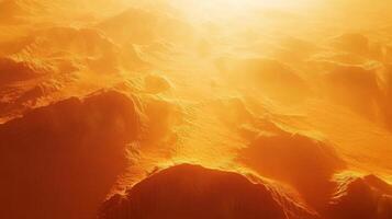 Golden hued textured mountainscape aerial perspective with radiant sunlit atmosphere photo