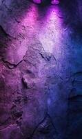 Stone texture wall illuminated by vibrant purple and blue lights giving a modern ambiance photo