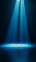 Mystical blue spotlights illuminating textured stage in a dark and dramatic ambiance photo