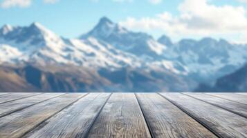 Wooden platform view overlooking the mountain range on a clear blue sky alpine backdrop photo