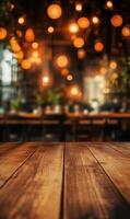 Rustic wooden table surface and blurred restaurant interior illuminated by warm lights ambiance photo