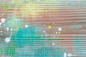 Colorful painted textured wooden plank with a paint stains. Abstract background for design. photo
