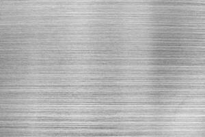 Monochrome texture of shiny scratched metal. photo