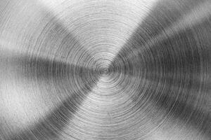 Stainless steel circular brushed shiny metal texture. Abstract metallic background. Circle shape. photo