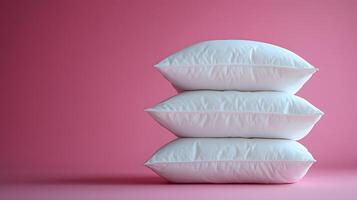 Pure white fluffy pillows stacked against soft pink background create minimalist composition with right-side positioning, emphasizing textile textures and comfort. minimalist photo