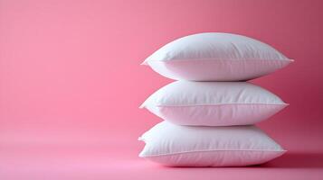 Pure white fluffy pillows stacked against soft pink background create minimalist composition with right-side positioning, emphasizing textile textures and comfort. relaxing photo