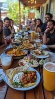 Delicious Mexican feast shared among friends during a sunny afternoon in a vibrant outdoor setting. photo