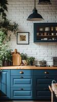 Elegant kitchen with blue cabinetry and plants showcasing a cozy atmosphere in a sunny space. photo
