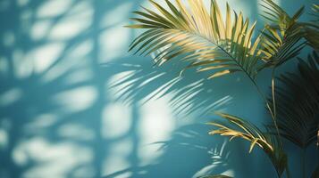 Sunlight casting shadows of palm leaves on a bright turquoise wall in a warm indoor setting. photo