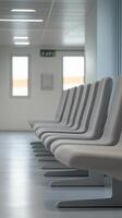 Modern waiting area with sleek seats in a well-lit corridor during daytime. photo