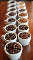 Coffee beans displayed in various roasts on wooden table at tasting event in bright light. photo