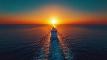 Cruise ship sailing into vibrant sunset over calm ocean waters. photo