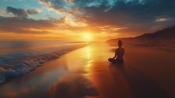 Meditation at sunset on a tranquil beach with gentle waves. photo