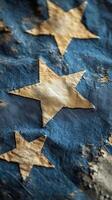 Antique flag with faded stars on a blue fabric background displayed indoors. photo