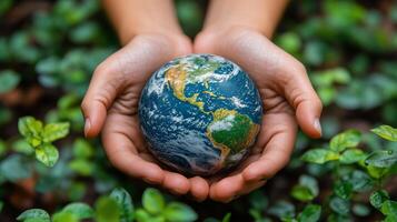 Protecting the planet while holding a globe surrounded by lush green plants. photo