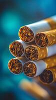 Close-up view of neatly arranged cigarettes showcasing tobacco filling and packaging details. photo