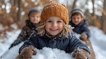 Children enjoying a winter day while sledding and playing in snow-covered forest. photo