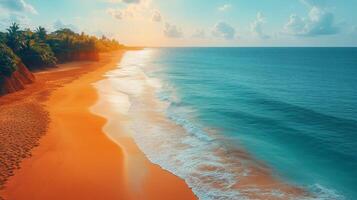 Stunning sunset reflecting on tranquil ocean waves along a sandy beach with lush greenery. photo
