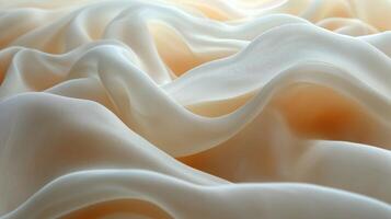 Delicate waves of sheer fabric create a subtle texture on a soft background. photo