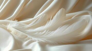 Soft white feathers resting on smooth cream fabric create a serene and elegant composition. photo