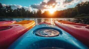 Sunset reflections on colorful kayaks in a serene lake landscape. photo