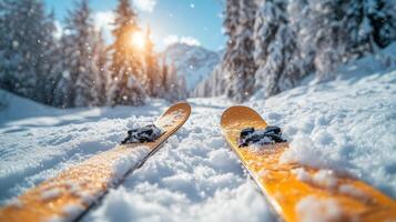 Snowy mountain trail with bright sun shining on skis during a winter afternoon. photo