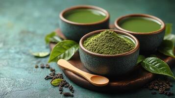 Display of vibrant green matcha tea and powder served in ceramic bowls on a wooden board. photo