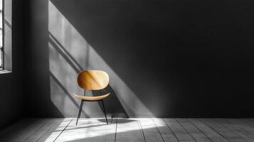 Single wooden chair in minimalistic room with sun rays casting shadows on the floor. photo