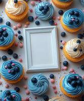 Colorful cupcakes decorated with blue frosting and fresh blueberries on a light background. photo