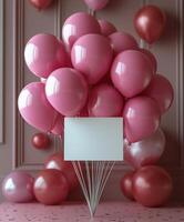 Birthday celebration with pink balloons and blank sign in a decorated space. photo